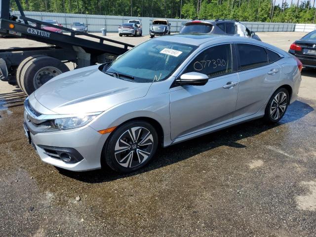 HONDA CIVIC EX 2018 with VIN JHMFC1F33JX036717 - Photo from auction