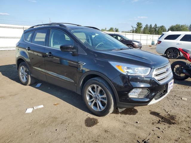 Photo 4 from auction – 2018 FORD ESCAPE SE with VIN 1FMCU9GD8JUC84272