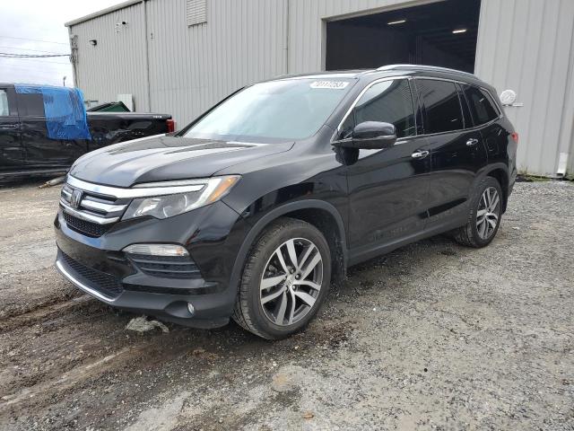 HONDA PILOT TOUR 2016 with VIN 5FNYF5H97GB054375 - Photo from auction