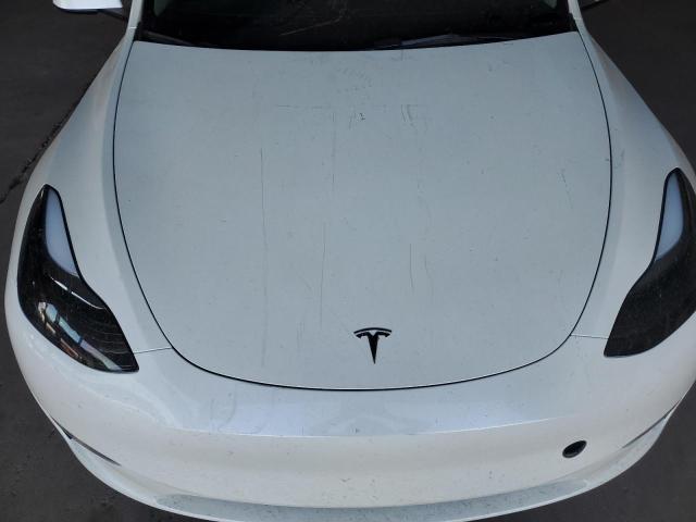 Photo 11 from auction – 2023 TESLA MODEL Y with VIN 7SAYGAEEXPF671165