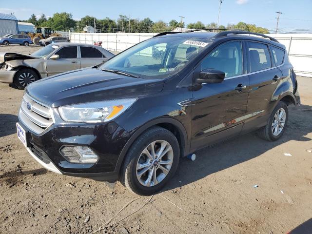 FORD ESCAPE SE 2018 with VIN 1FMCU9GD8JUC84272 - Photo from auction