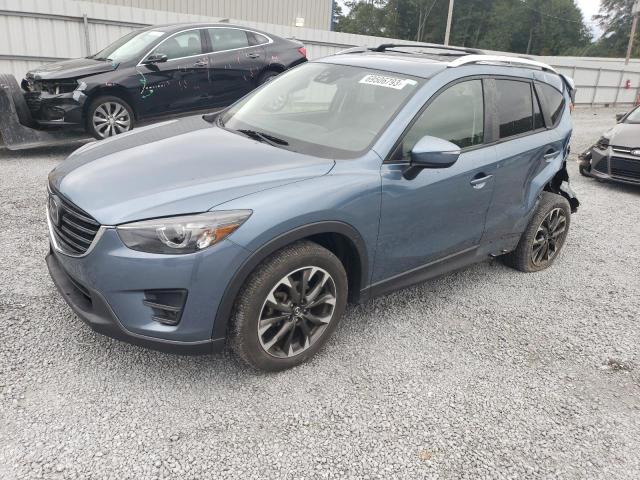 MAZDA CX-5 GT 2016 with VIN JM3KE2DY9G0695019 - Photo from auction