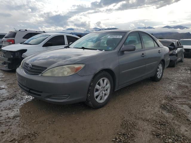 TOYOTA CAMRY LE 2002 with VIN 4T1BE30K32U587928 - Photo from auction