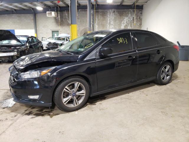 FORD FOCUS SE 2018 with VIN 1FADP3F24JL214003 - Photo from auction