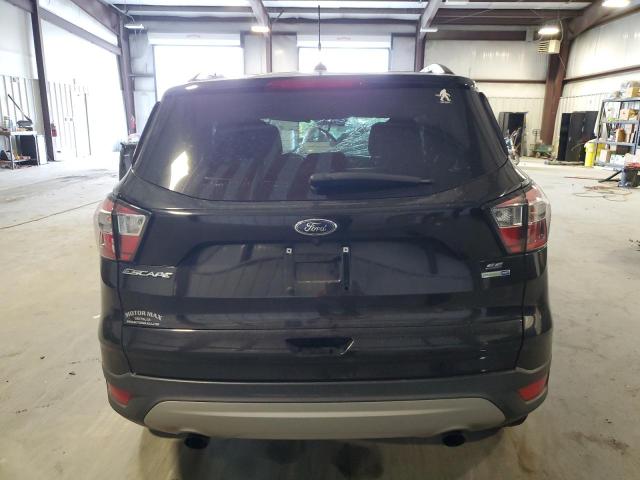 Photo 6 from auction – 2018 FORD ESCAPE SE with VIN 1FMCU9GD1JUC12524
