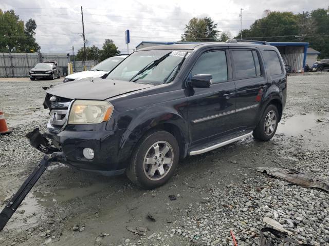HONDA PILOT TOUR 2011 with VIN 5FNYF3H98BB027392 - Photo from auction
