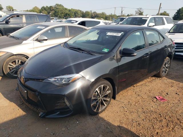TOYOTA COROLLA L 2018 with VIN 5YFBURHE4JP812765 - Photo from auction