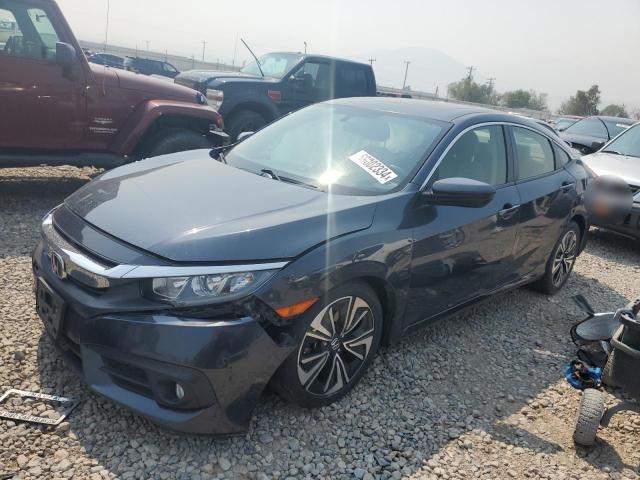 HONDA CIVIC EX 2018 with VIN JHMFC1F3XJX021664 - Photo from auction