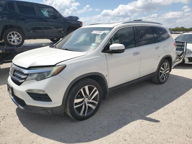 HONDA PILOT TOUR 2016 with VIN 5FNYF5H92GB019873 - Photo from auction