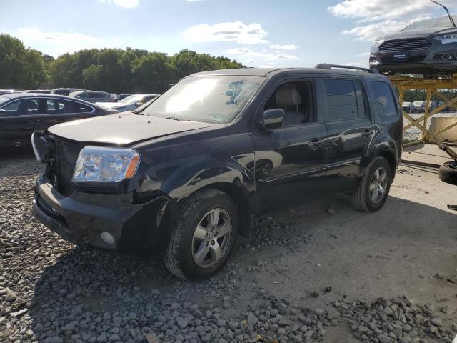 HONDA PILOT EXLN 2011 with VIN 5FNYF4H74BB018984 - Photo from auction