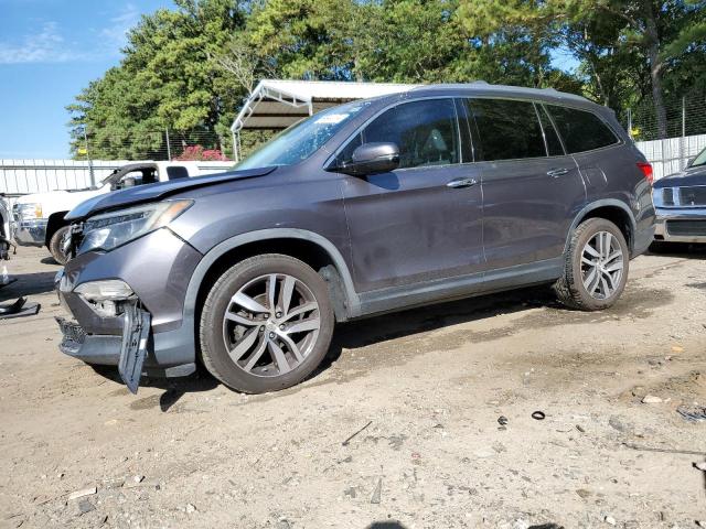 HONDA PILOT ELIT 2017 with VIN 5FNYF6H02HB100848 - Photo from auction