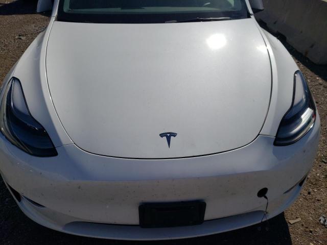 Photo 11 from auction – 2023 TESLA MODEL Y with VIN 7SAYGAEE6PF760327