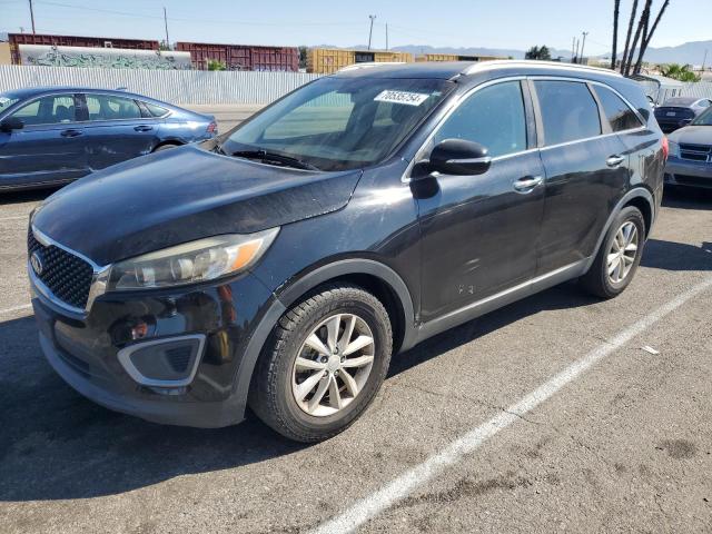 KIA SORENTO LX 2016 with VIN 5XYPG4A30GG061900 - Photo from auction