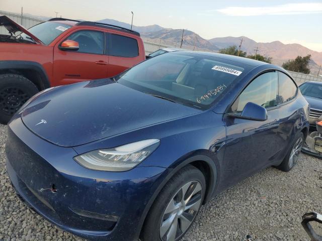 TESLA MODEL Y 2022 with VIN 7SAYGDEE0NF570943 - Photo from auction