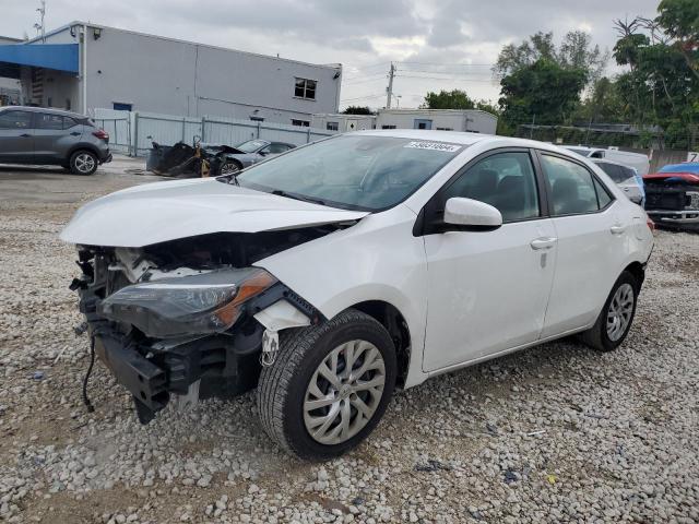TOYOTA COROLLA L 2019 with VIN 5YFBURHE4KP869288 - Photo from auction
