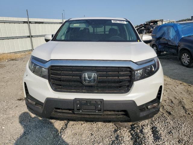 Photo 5 from auction – 2023 HONDA RIDGELINE with VIN 5FPYK3F76PB045434