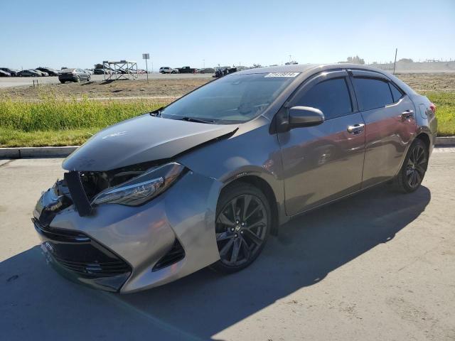 TOYOTA COROLLA L 2018 with VIN 5YFBURHE5JP758019 - Photo from auction