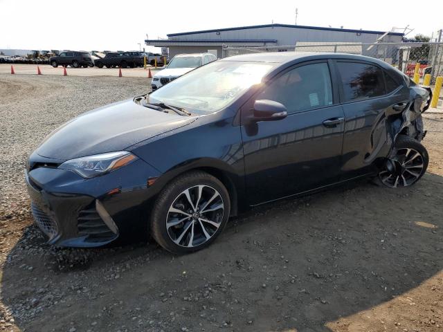 TOYOTA COROLLA L 2018 with VIN 5YFBURHE7JP784749 - Photo from auction