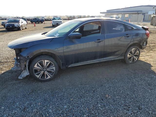 HONDA CIVIC EXL 2017 with VIN 2HGFC1F74HH641060 - Photo from auction