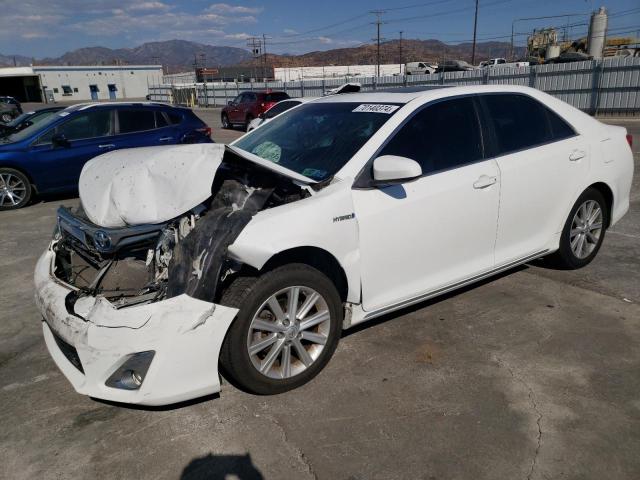 TOYOTA CAMRY HYBR 2014 with VIN 4T1BD1FK2EU101306 - Photo from auction