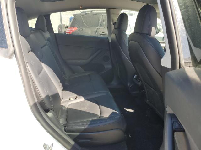 Photo 11 from auction – 2023 TESLA MODEL Y with VIN 7SAYGAEE6PF601422