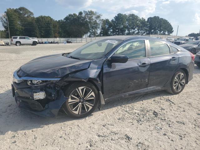 HONDA CIVIC EXL 2018 with VIN JHMFC1F72JX020382 - Photo from auction