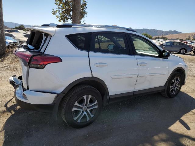 Photo 3 from auction – 2018 TOYOTA RAV4 LE with VIN JTMZFREV2JJ198655