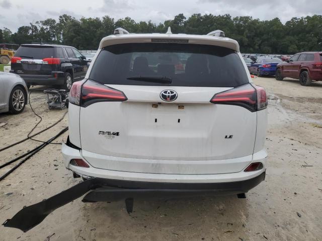 Photo 6 from auction – 2018 TOYOTA RAV4 LE with VIN JTMZFREV9JJ158427
