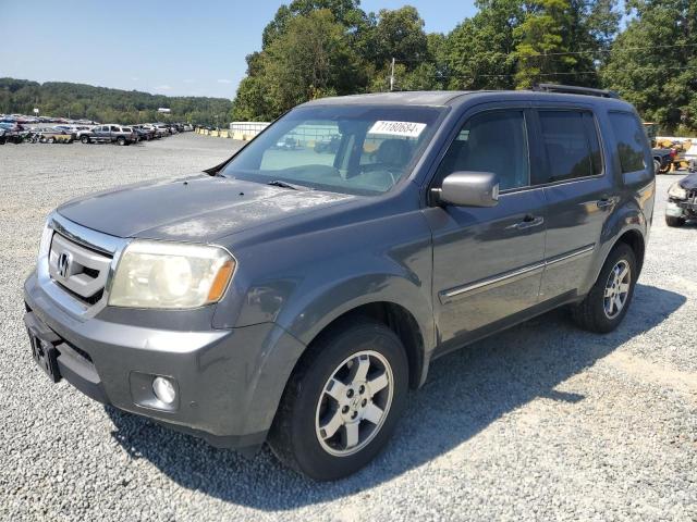 HONDA PILOT TOUR 2010 with VIN 5FNYF3H96AB005650 - Photo from auction