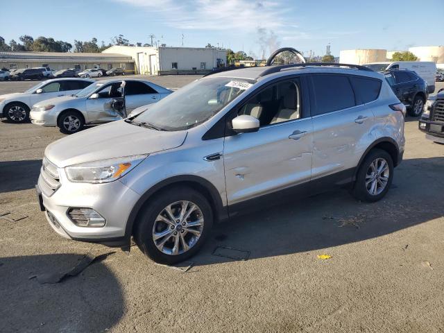 FORD ESCAPE SE 2018 with VIN 1FMCU0GD0JUC77103 - Photo from auction