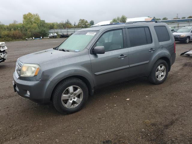 HONDA PILOT EXL 2011 with VIN 5FNYF4H51BB047633 - Photo from auction