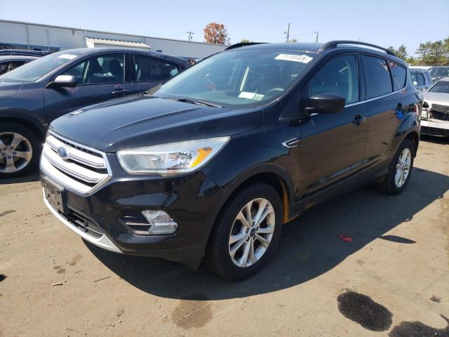 FORD ESCAPE SE 2018 with VIN 1FMCU9GDXJUA15187 - Photo from auction