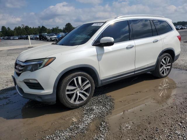 HONDA PILOT TOUR 2016 with VIN 5FNYF6H92GB056315 - Photo from auction