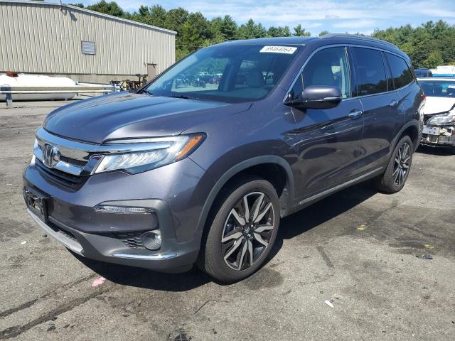HONDA PILOT TOUR 2021 with VIN 5FNYF6H63MB005018 - Photo from auction