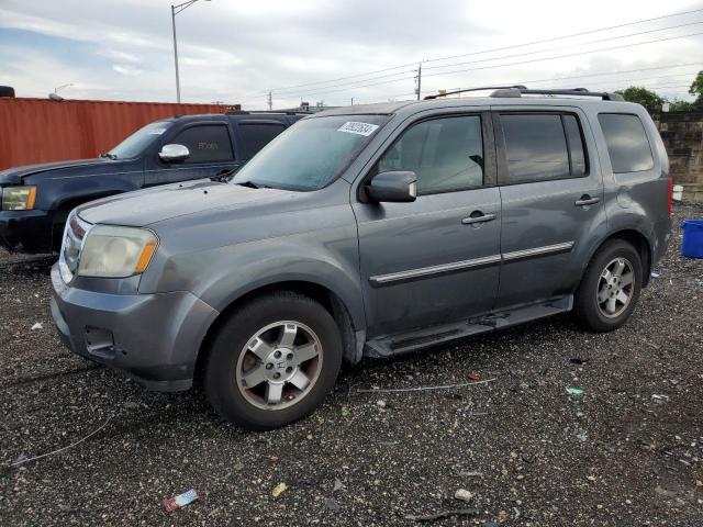 HONDA PILOT TOUR 2010 with VIN 5FNYF4H89AB010418 - Photo from auction