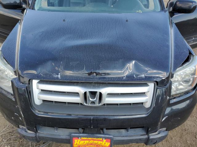 Photo 11 from auction – 2006 HONDA PILOT EX with VIN 5FNYF28546B047023