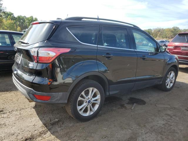 Photo 3 from auction – 2017 FORD ESCAPE SE with VIN 1FMCU9GD6HUD02116