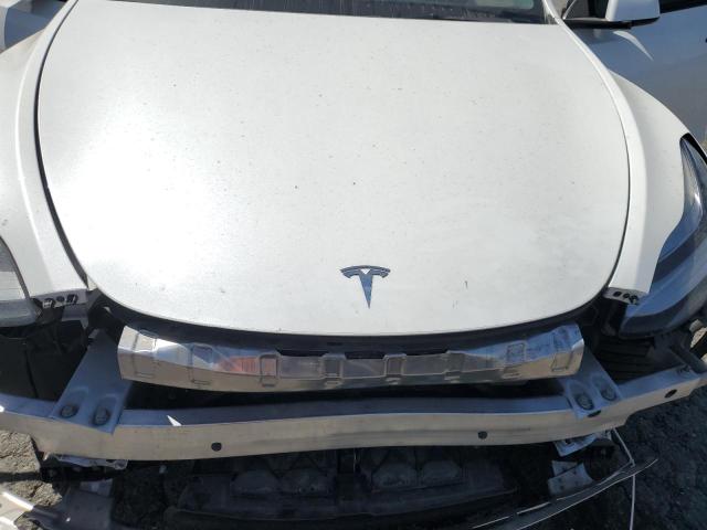 Photo 11 from auction – 2023 TESLA MODEL Y with VIN 7SAYGDEE8PA024133