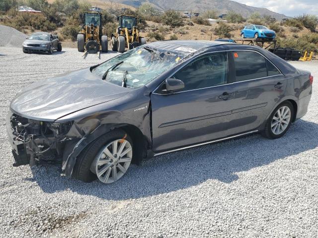 TOYOTA CAMRY HYBR 2014 with VIN 4T1BD1FK2EU100673 - Photo from auction
