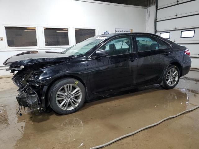 TOYOTA CAMRY LE 2017 with VIN 4T1BF1FKXHU334087 - Photo from auction
