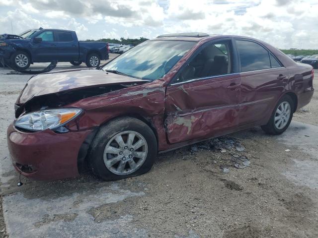 TOYOTA CAMRY LE 2004 with VIN 4T1BF30K34U077563 - Photo from auction