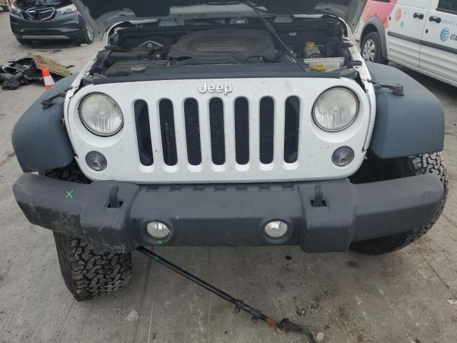 Photo 11 from auction – 2014 JEEP WRANGLER U with VIN 1C4BJWFG1EL246185