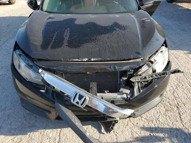 Photo 11 from auction – 2016 HONDA CIVIC LX with VIN 19XFC2F51GE099252