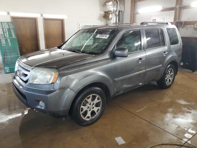 HONDA PILOT EXLN 2011 with VIN 5FNYF4H71BB037623 - Photo from auction
