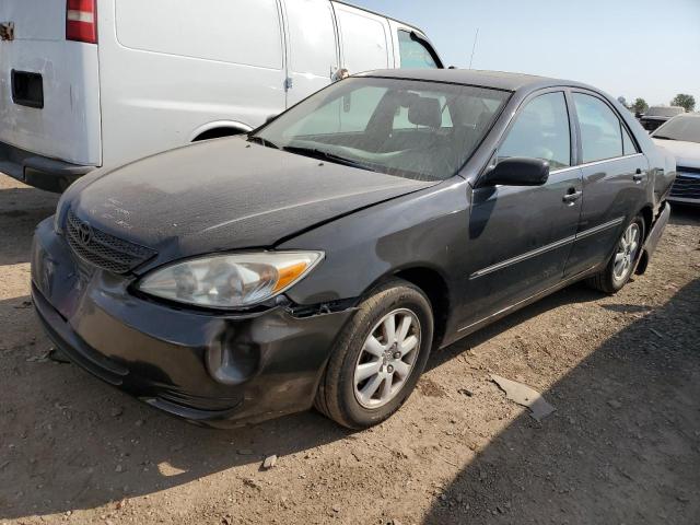 TOYOTA CAMRY LE 2002 with VIN 4T1BF30K42U029082 - Photo from auction