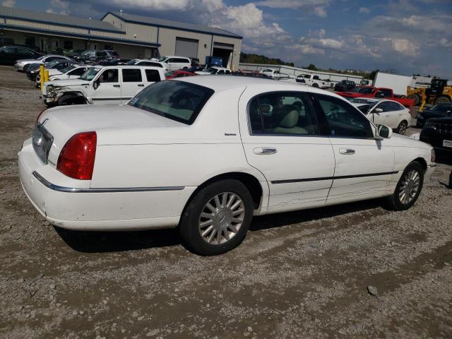 Photo 3 from auction – 2004 LINCOLN TOWN CAR E with VIN 1LNHM81W14Y649222