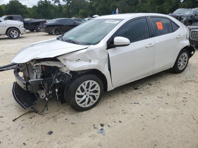 TOYOTA COROLLA L 2019 with VIN 5YFBURHE1KP910332 - Photo from auction