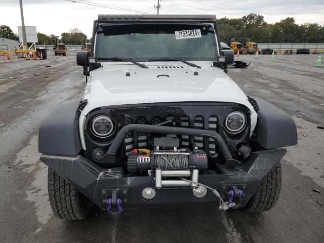 Photo 5 from auction – 2016 JEEP WRANGLER U with VIN 1C4BJWDG6GL237293