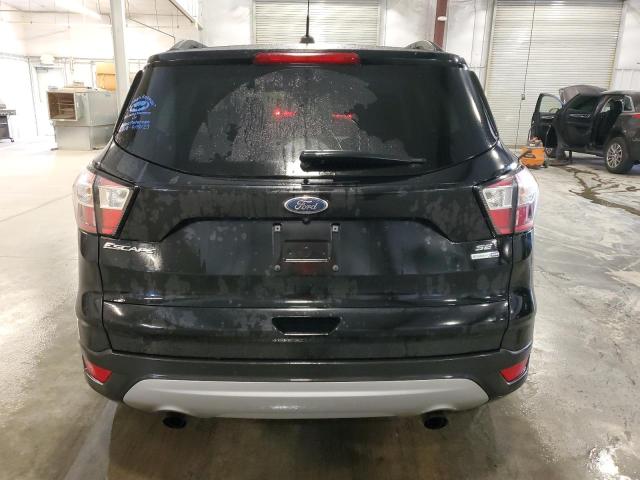 Photo 6 from auction – 2018 FORD ESCAPE SE with VIN 1FMCU9GD7JUC40568