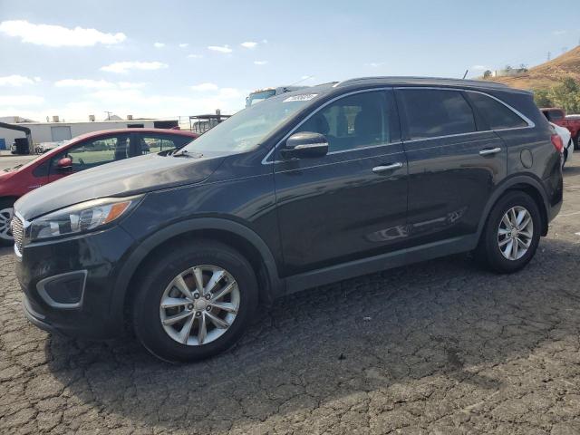 KIA SORENTO LX 2016 with VIN 5XYPG4A55GG152744 - Photo from auction